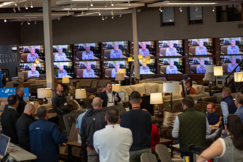 Group of people in an electronics showroom